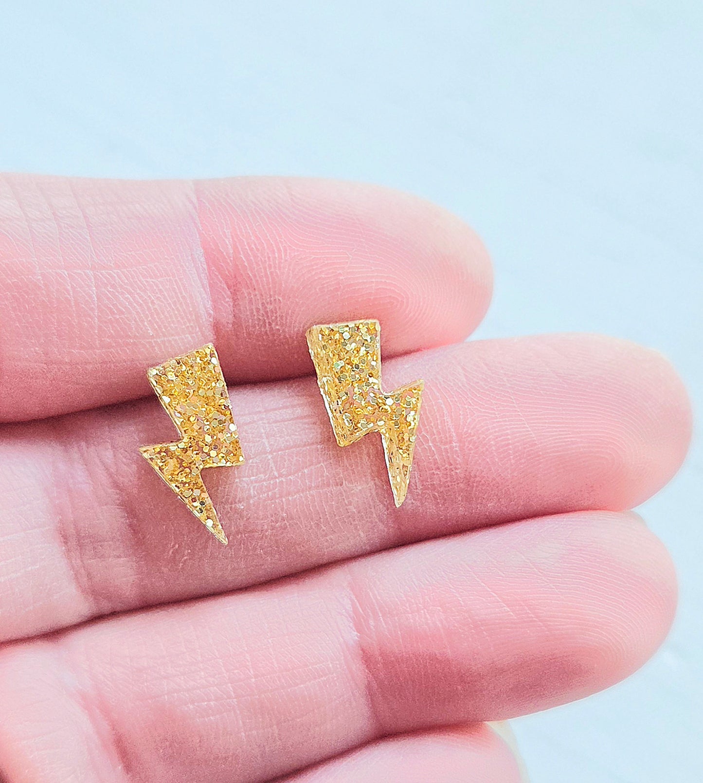 Lightning bolt studs, Gold glitter