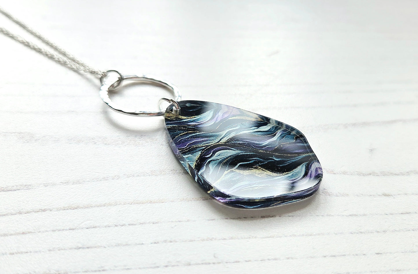 Pebble pendant with hammered hoop, purple, green, gold ripple print
