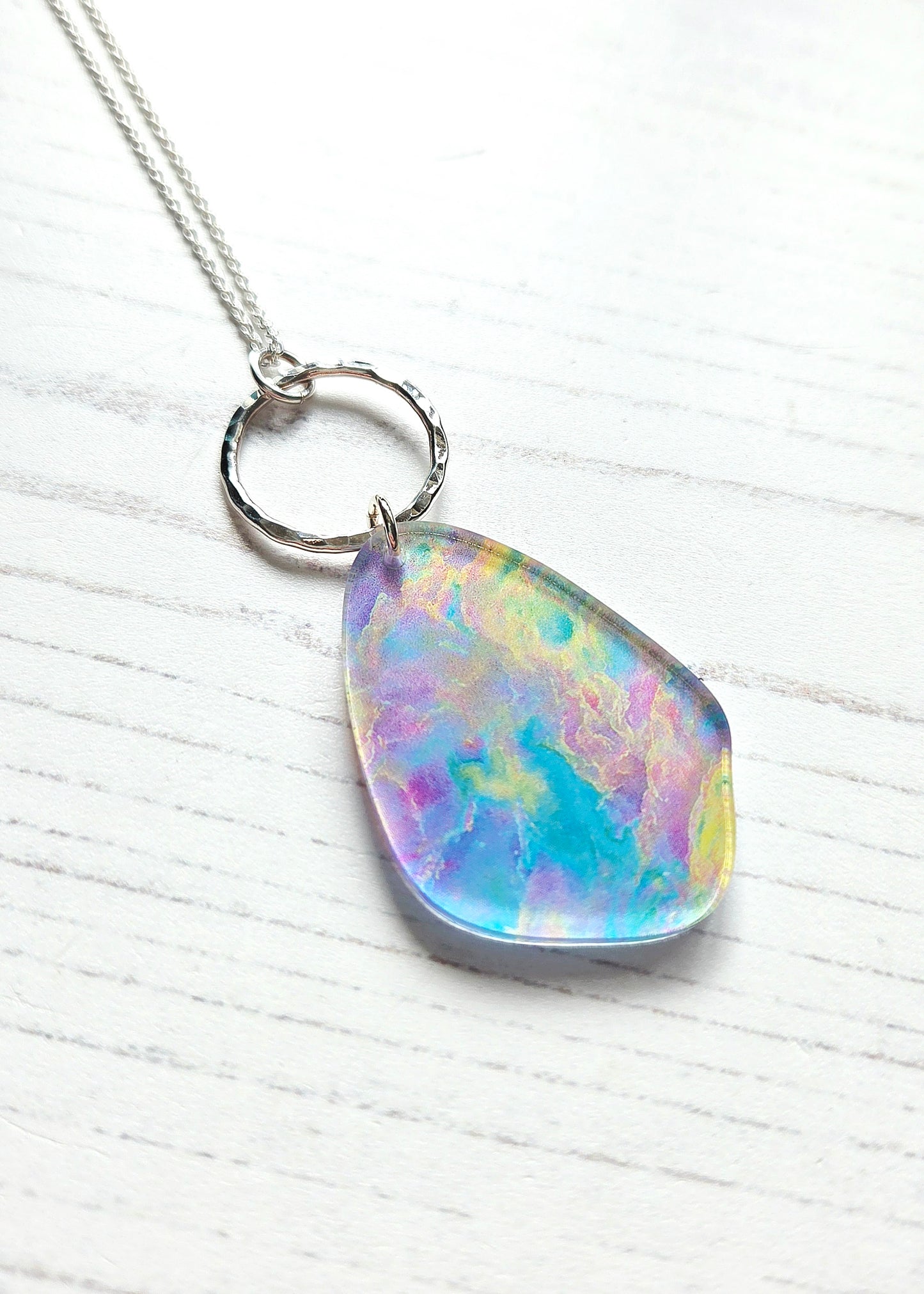 Pebble pendant with hammered silver hoop, Opal print