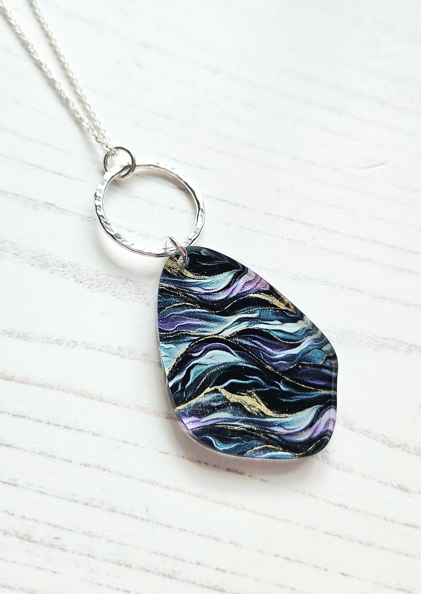 Pebble pendant with hammered hoop, purple, green, gold ripple print