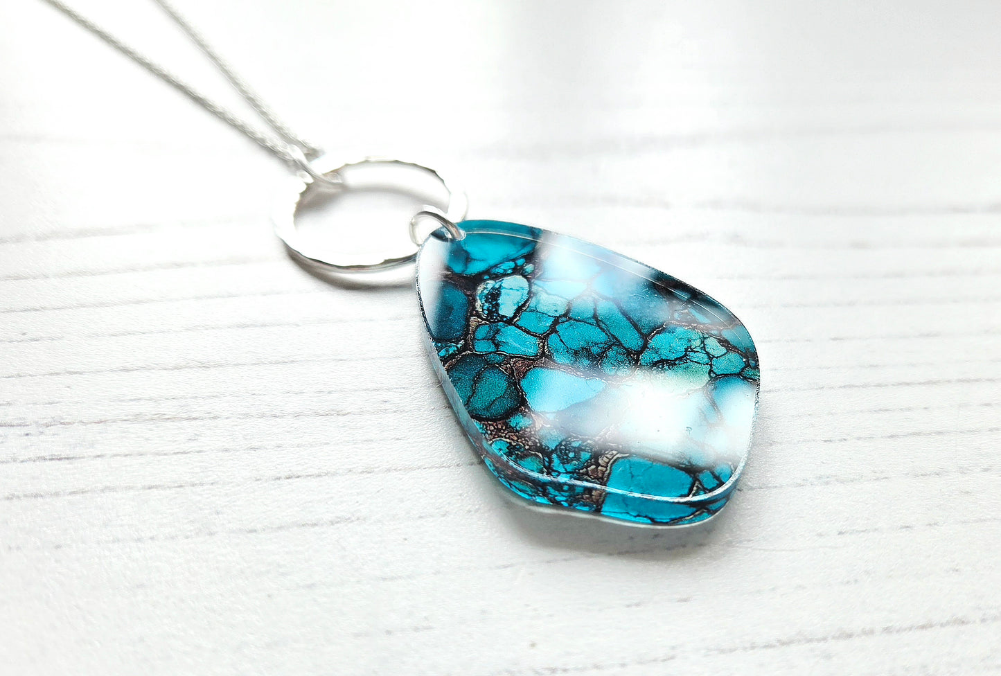 Pebble and hammered circle pendant, natural turquoise print