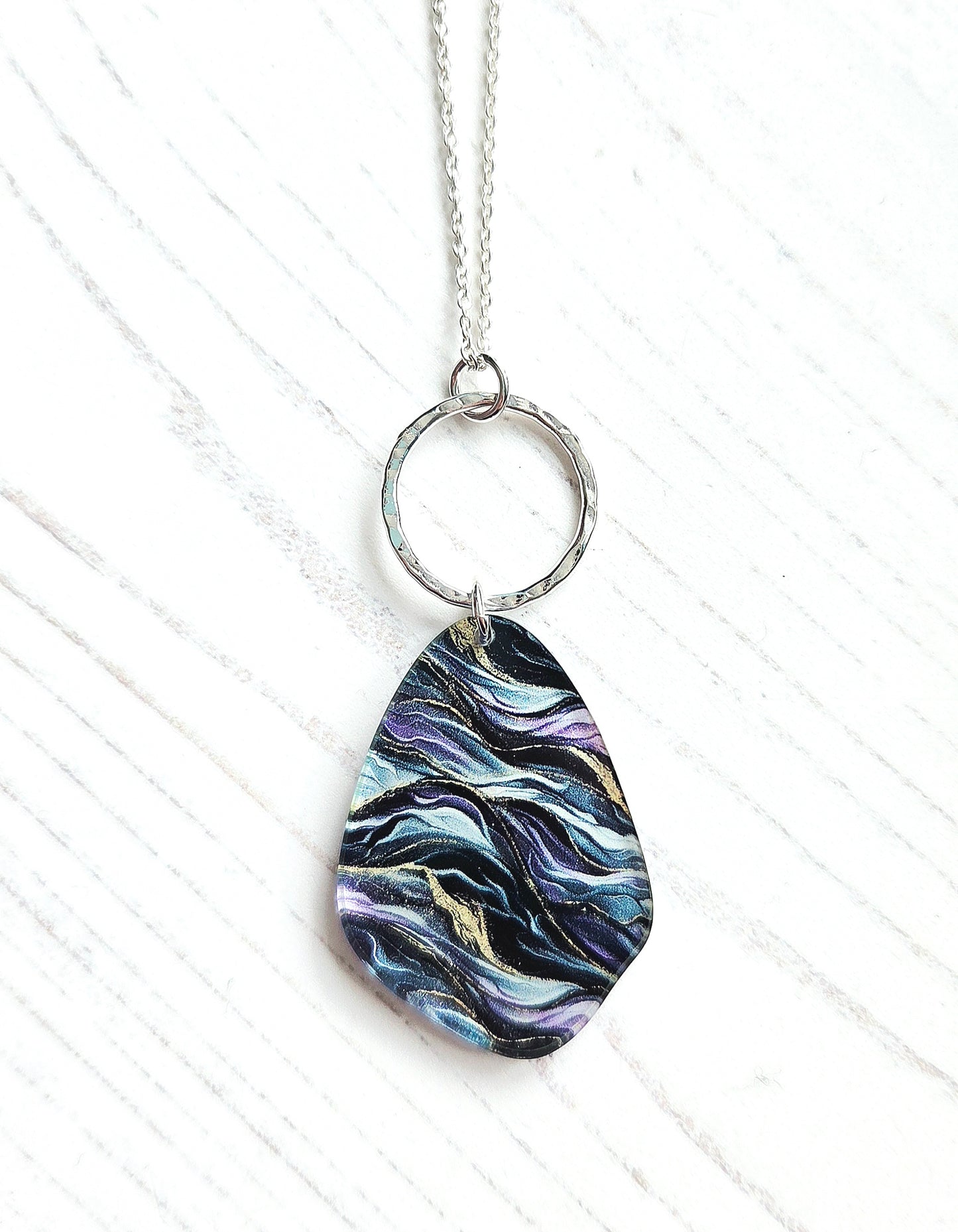 Pebble pendant with hammered hoop, purple, green, gold ripple print