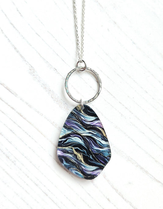 Pebble pendant with hammered hoop, purple, green, gold ripple print