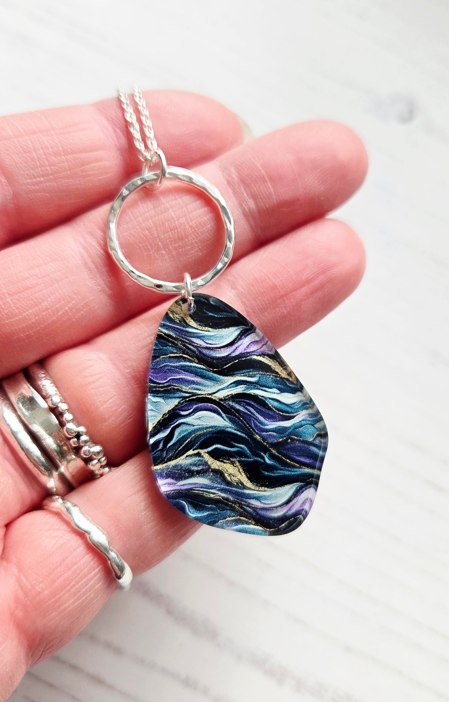 Pebble pendant with hammered hoop, purple, green, gold ripple print